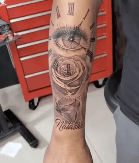 Black and Grey Roman Numerals Eye Clock With Rose Arm Tattoo