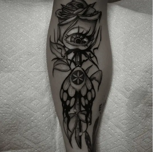 Black and Grey Eye Rose With Butterfly Leg Tattoo
