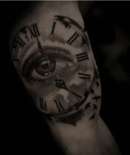 Black and Grey Human Eye Clock Arm Tattoo