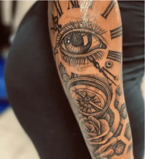 Black and Grey Eye With Clock and Rose Arm Tattoo