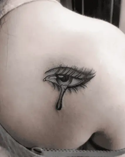 Black and Grey Female Teary Eye Back Tattoo