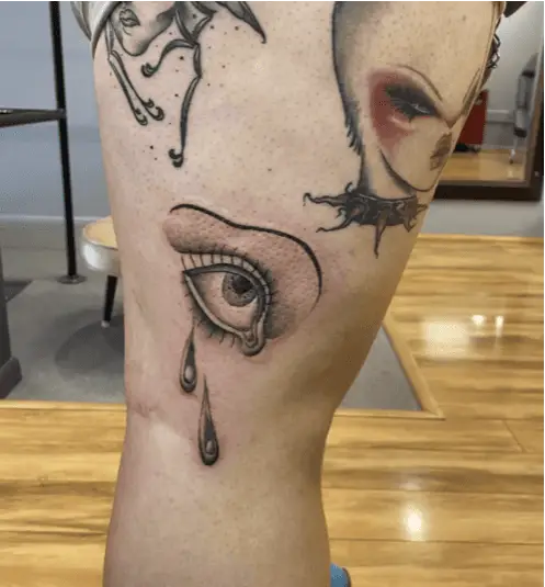 Black and Grey Crying Eye Thigh Tattoo