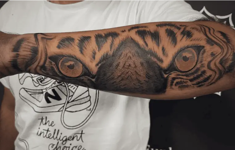 Detailed Tiger Colored Eye Arm Tattoo