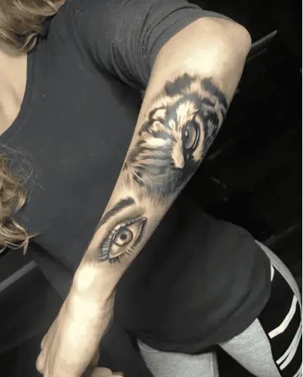 Black and Grey Half Female Eye Half Tiger Eye Arm Tattoo