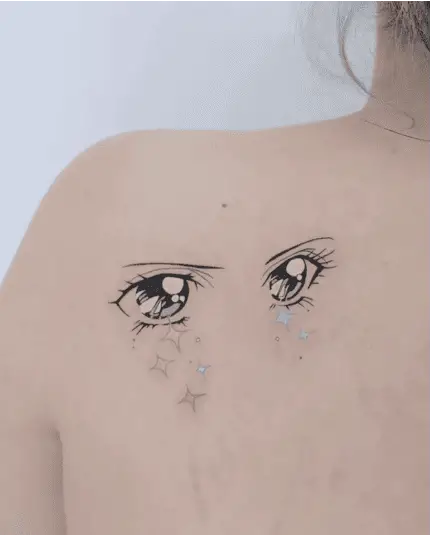 Colored Female Anime Eyes With Sparkles Back Tattoo