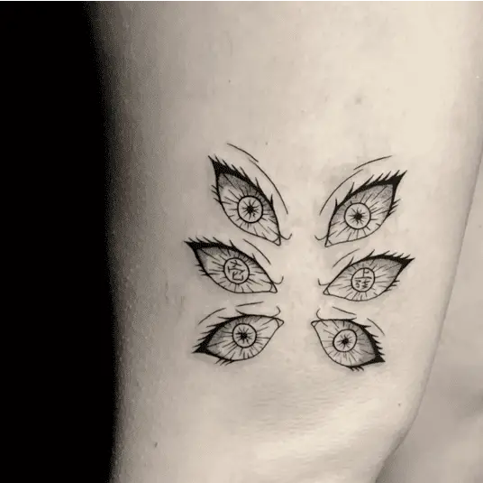 Mysterious and Captivating Gaze Anime Six Eyes Arm Tattoo