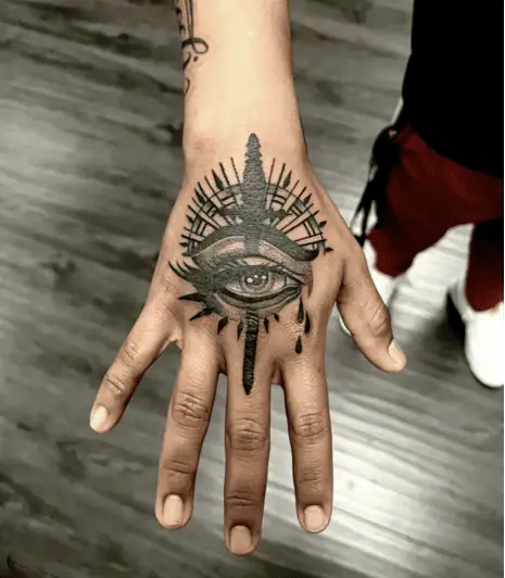 Black Work Eye With Sword Hand Tattoo