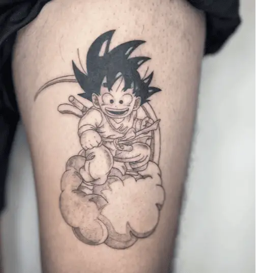 Black and Grey Kid Goku Riding on a Cloud Thigh Tattoo