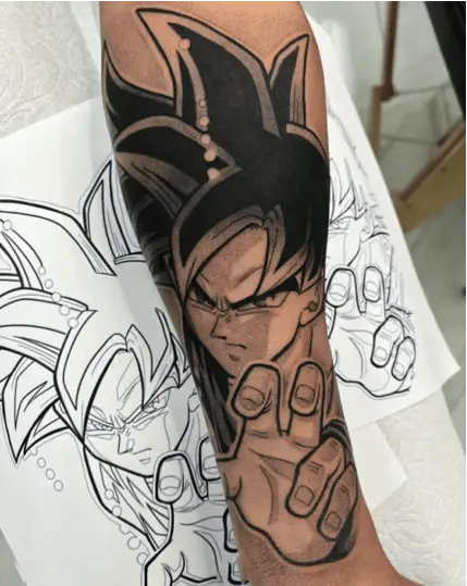 Whip Shade Son Goku With Intense Facial Expression Arm Tattoo