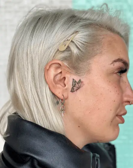Tiny Butterfly Sideburn Face Tattoo