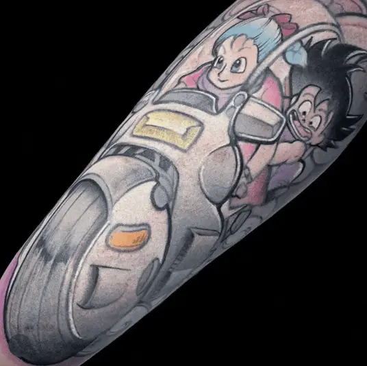 Colored Bulma and Kid Son Goku Riding on a Motorcycle Arm Tattoo
