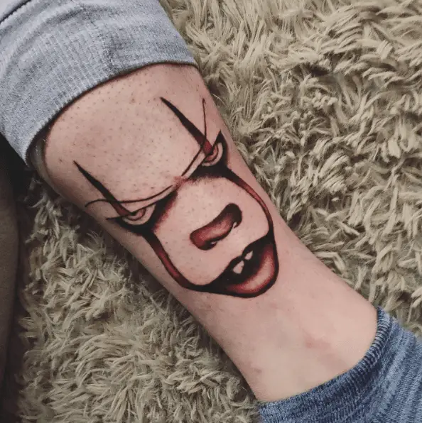 Metallic Red Ink Pennywise Tattoo 