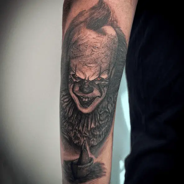 Dark Grayscale Pennywise Clown with Paper Boat Sleeve Tattoo