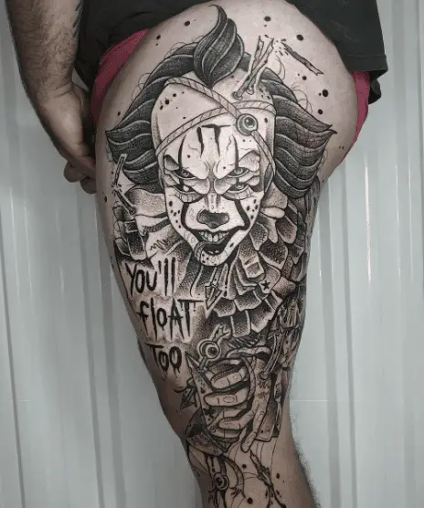 Black and Grey Pennywise Clown with Lettering Thigh Tattoo