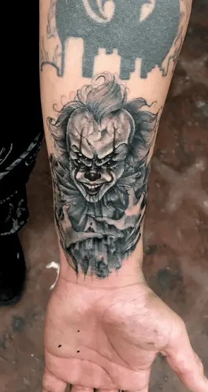 Evil Looking Pennywise Clown Forearm Tattoo