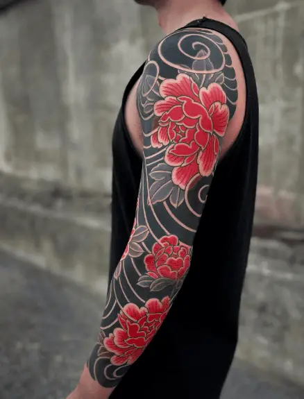 Red Japanese Peonies with Polynesian Background Sleeve Tattoo