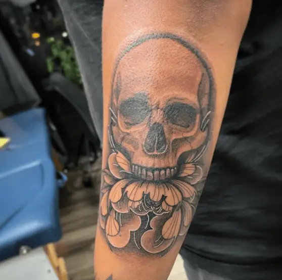 Greyscale Skull and Peony Forearm Tattoo