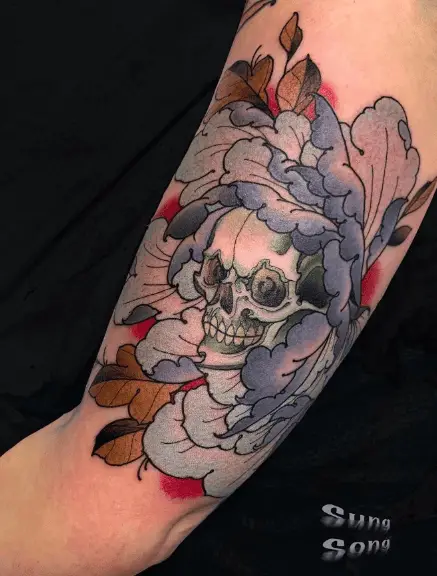 Skull Covered with Peony Florals Tattoo