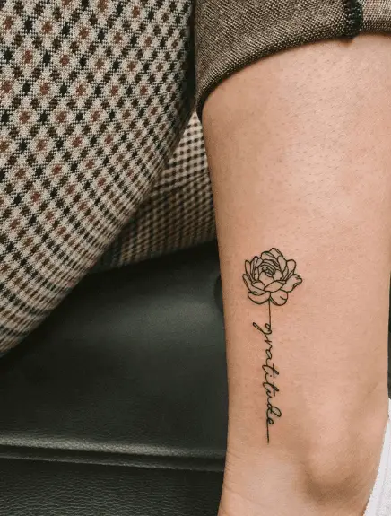 Simple Peony and Script Arm Tattoo