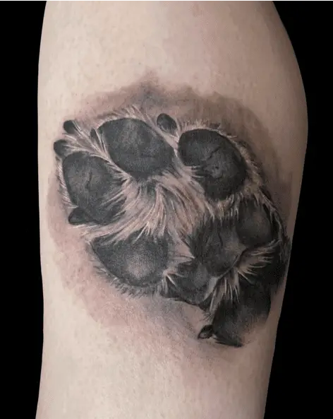 Black and Grey Dog Paw Arm Tattoo