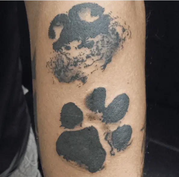 Black Ink Dog Nose and Paw Print Arm Tattoo