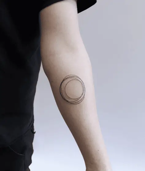 Chaotic Circles Forearm Tattoo