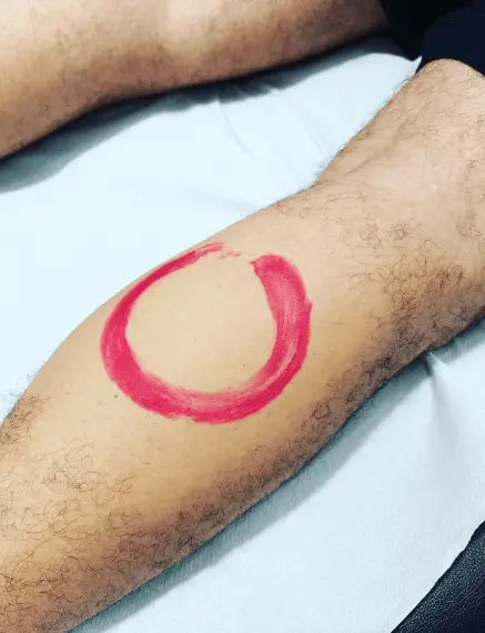 Red Ink Zen Circle Calf Tattoo