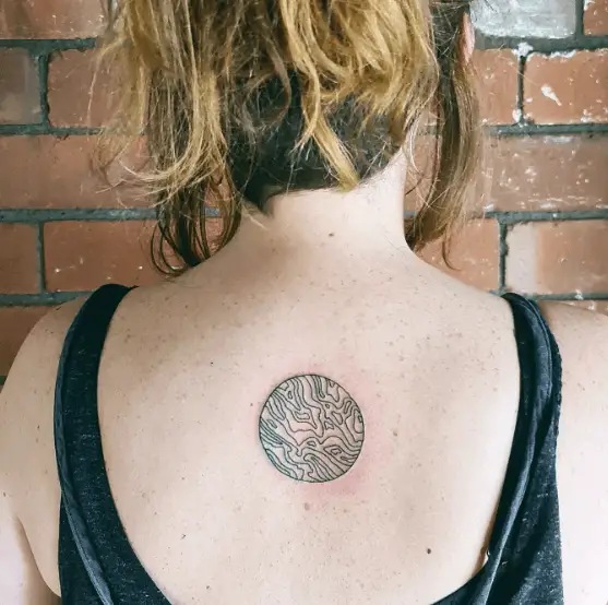 Small Circle with Swirl Lines Back Tattoo