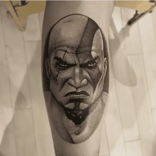 Black And Grey Kratos Arm Tattoo