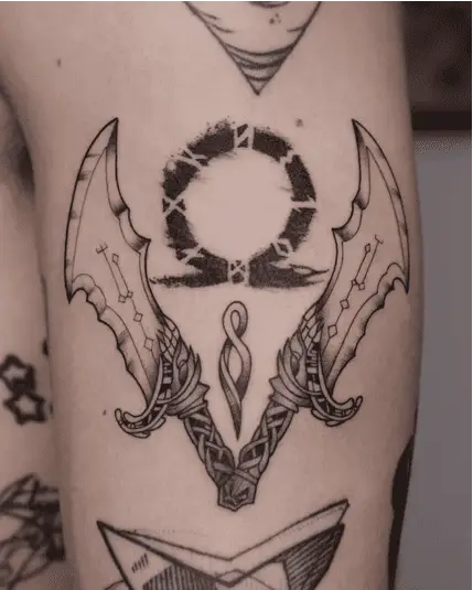 Omega Symbol in the Middle of Blades of Chaos Arm Tattoo