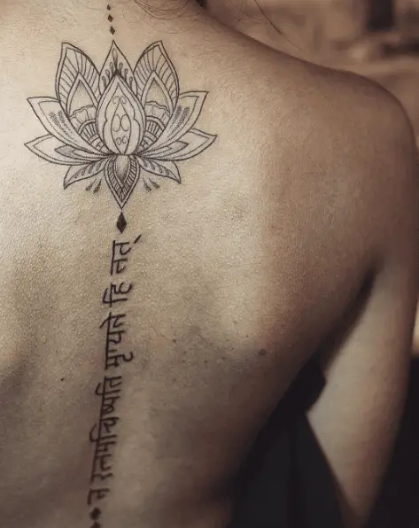 Lotus and Sanskrit Lettering Back Tattoo
