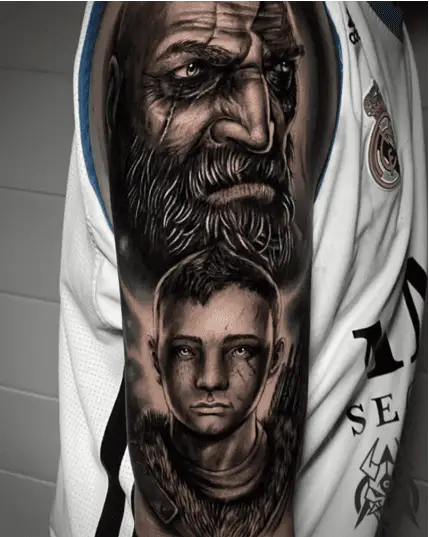 Black and Grey Kratos and Arteus Upper Arm Tattoo