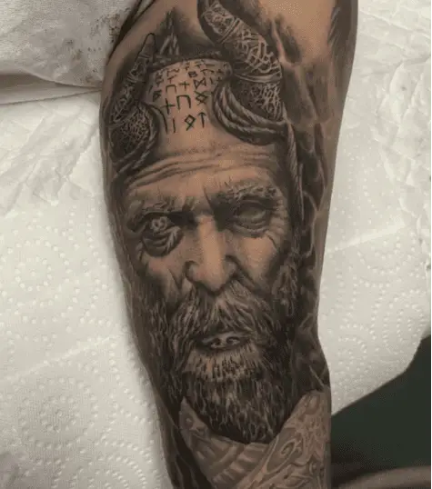 Black and Grey Mimir Head Upper Arm Tattoo