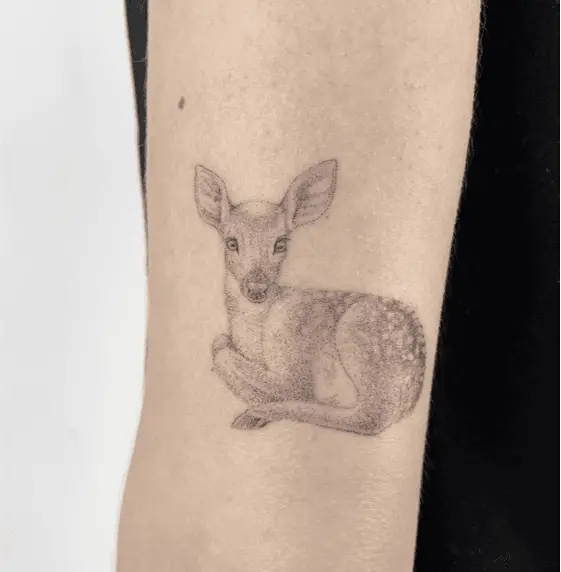 Dotted Fawn Sitting Arm Tattoo