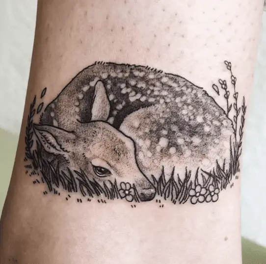 Young Fawn Resting By Flowers Tattoo