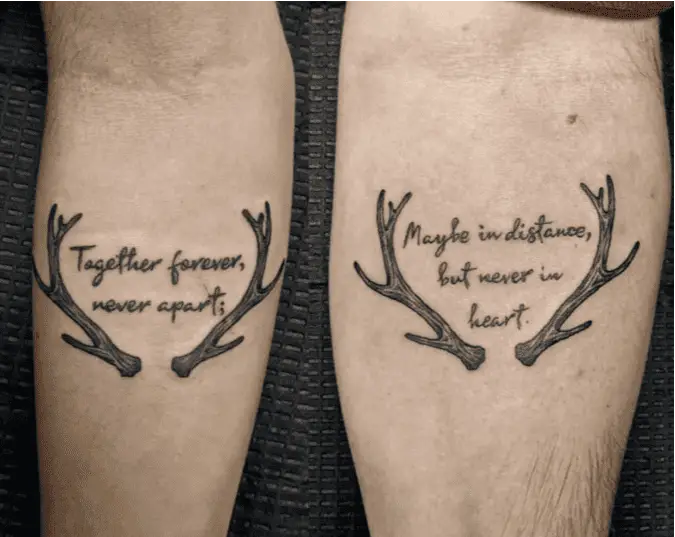 Quotes and Antlers Arm Tattoo