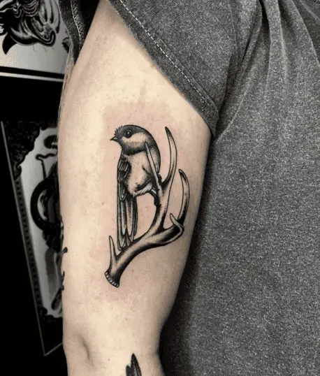 Bird on the Deer Antler Upper Arm Tattoo