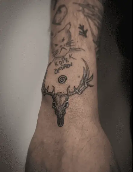 Tiny Deer Skull Wrist Tattoo