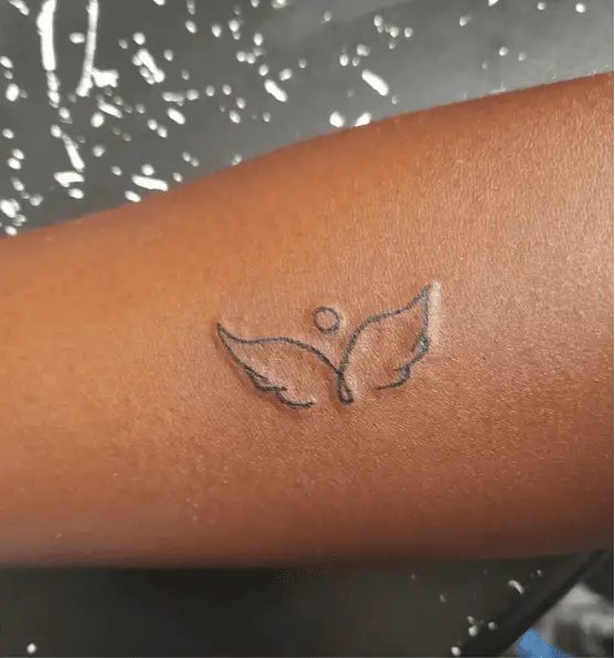 Line Art Angel Wings Wrist Tattoo