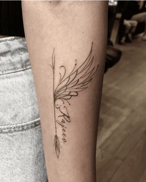 Fine Line Single Angel Wing With Name Arm Tattoo