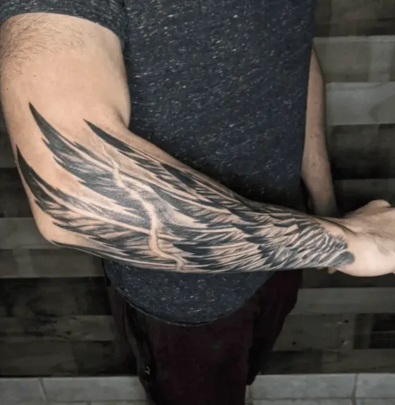 Black and Grey Single Angel Wing Arm Tattoo