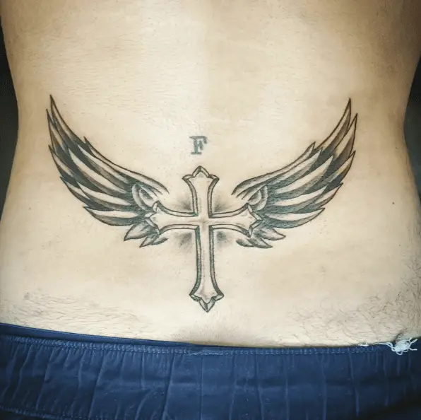 Black Work Cross and Angel Wing Lower Back Tattoo