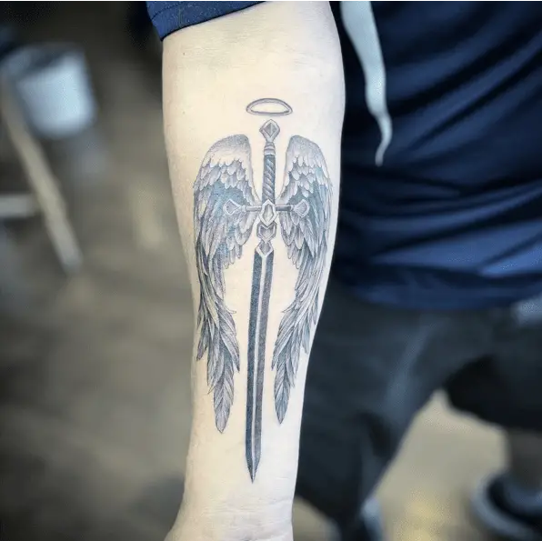 Halo Sword And Angel Wing Arm Tattoo