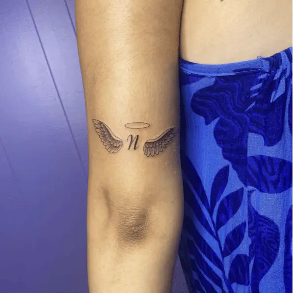 Memorial Angel Wing With Initial Arm Tattoo