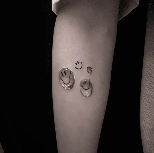 Smiley Face Water Drop Arm Tattoo