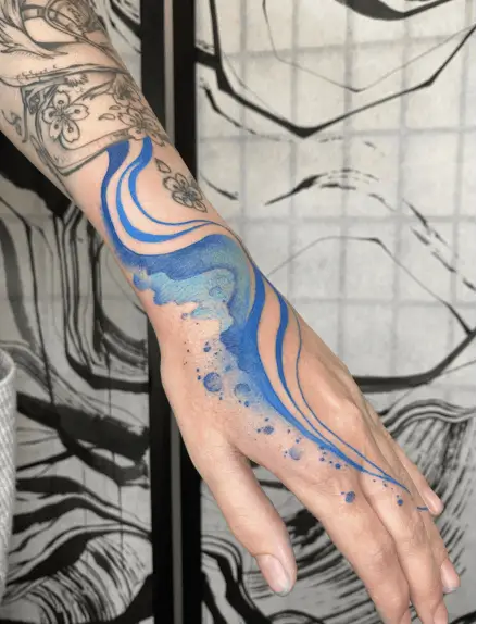 Blue Wavy Water Hand Tattoo