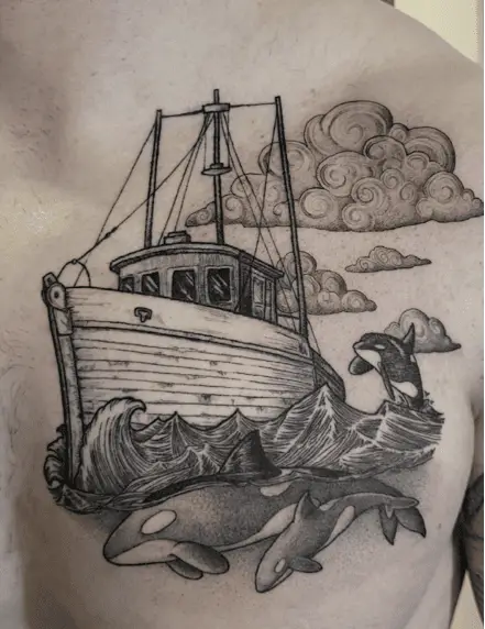 Boat Sailing on a Cloudy Ocean with Dolphins Chest Tattoo