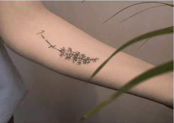 I am Enough With Larkspur Flower Arm Tattoo