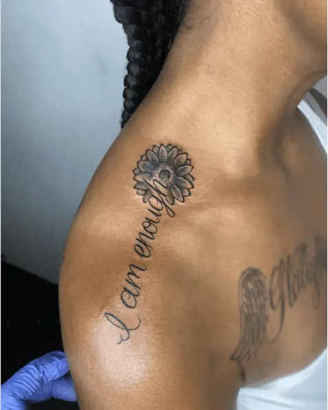 Black and Grey Cursive I am Enough With Sunflower Head Shoulder Tattoo