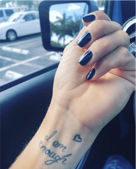 Cursive I am Enough With Small Outline Heart Wrist Tattoo
